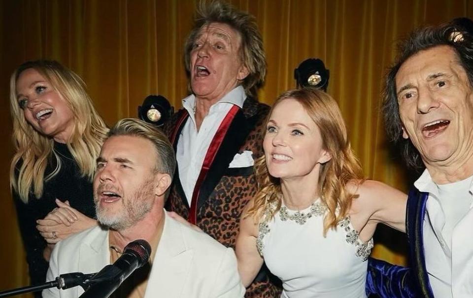 Emma Bunton, Gary Barlow, Rod Stewart, Geri Horner and Ronnie Wood around the piano at Christian Horner’s surprise birthday party