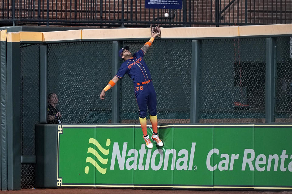 Houston Astros center fielder Jose Siri tries to catch a two-run home run by Cleveland Guardians' Jose Ramirez during the fifth inning of a baseball game Monday, May 23, 2022, in Houston. (AP Photo/David J. Phillip)