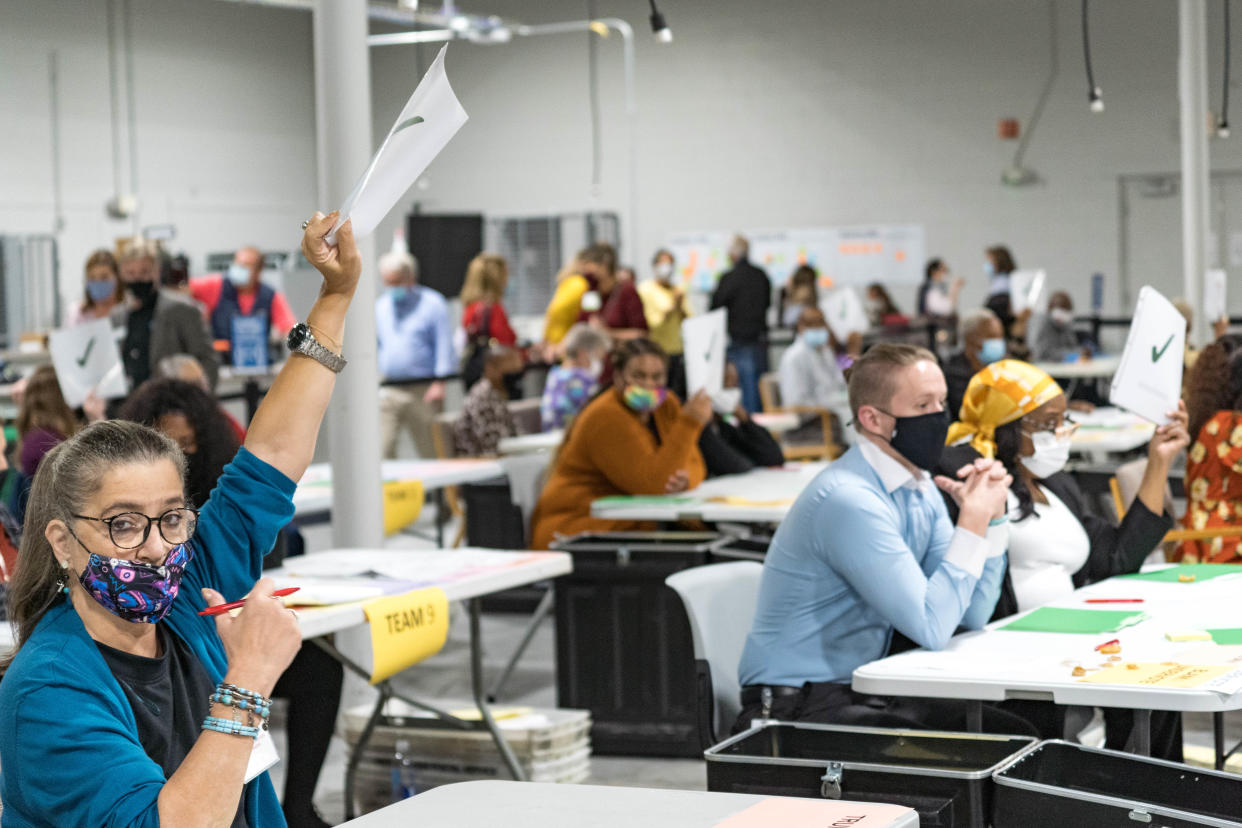 <p>Gwinnett county workers carry out their recount of the ballots on November 13, 2020 in Lawrenceville, Georgia. (Photo by Megan Varner/Getty Images)</p> (Getty Images)