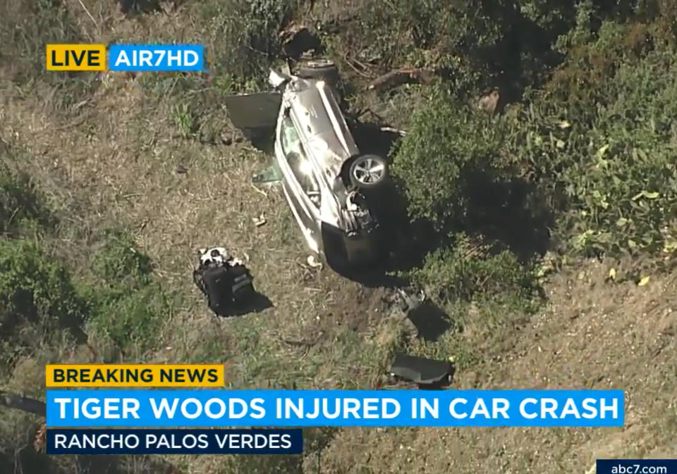 In this aerial image take from video provided by KABC-TV video, a vehicle rest on its side after a rollover accident involving golfer Tiger Woods along a road in the Rancho Palos Verdes section of Los Angeles on Tuesday, Feb. 23, 2021. Woods had to be extricated from the vehicle with the "jaws of life" tools, the Los Angeles County Sheriff's Department said in a statement. Woods was taken to the hospital with unspecified injuries. The vehicle sustained major damage, the sheriff's department said. (KABC-TV via AP)