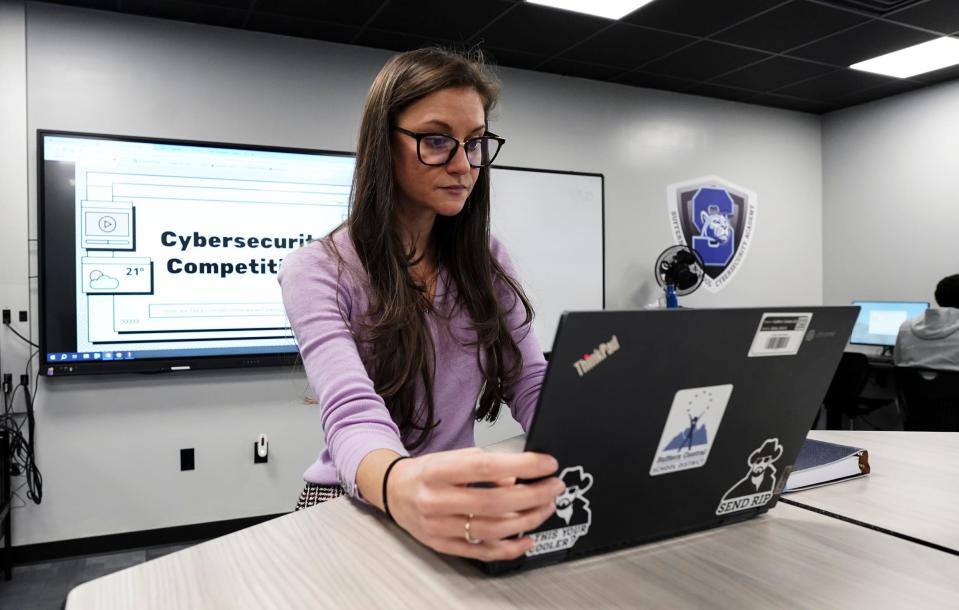 Suffern High School's Cybersecurity Academy teacher Ariel Sanzo performs tasks on her laptop. Friday, November 3, 2023.