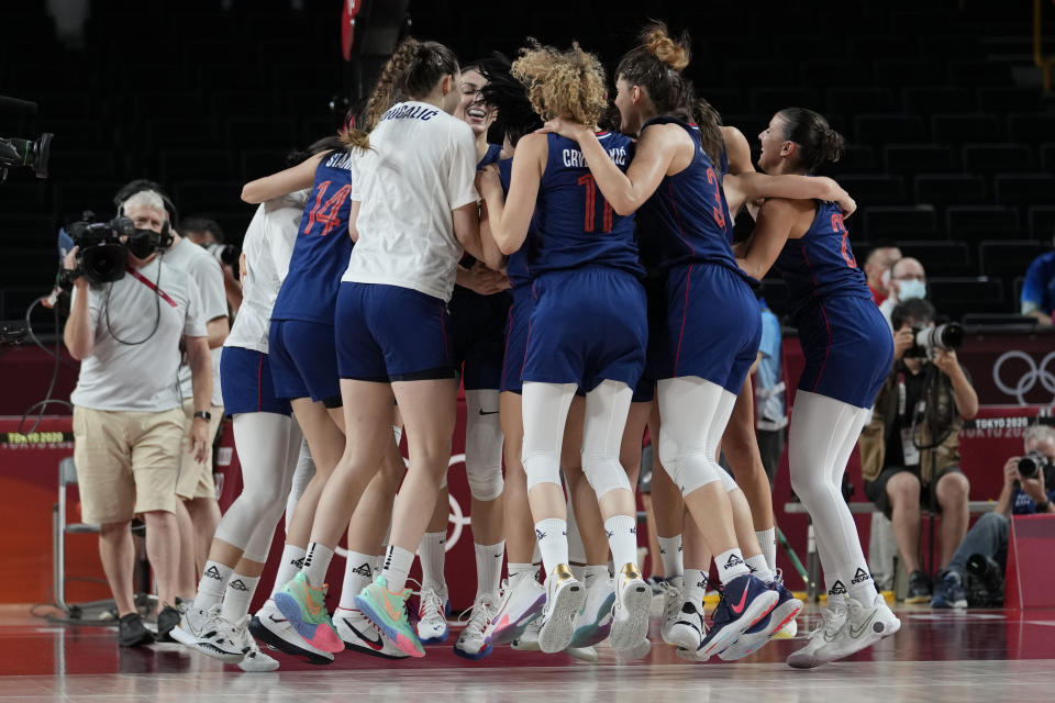 Serbia players jump up and down as they celebrate their win over China in a women's basketball quarterfinal game at the 2020 Summer Olympics, Wednesday, Aug. 4, 2021, in Saitama, Japan. (AP Photo/Eric Gay)