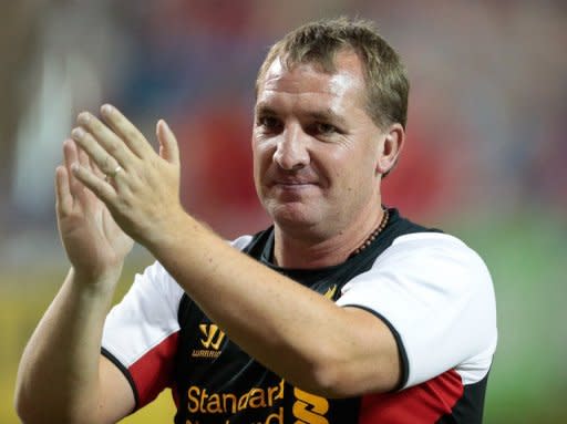 Brendan Rodgers, manager of Liverpool FC, acknowledges the crowd after his side won the World Football Challenge match against Toronto FC on July 21. Rodgers' first game as manager of Liverpool ended in a 1-1 draw against FC Toronto thanks to Adam Morgan's equaliser