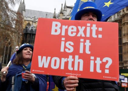 Anti-Brexit protestor Steve Bray holds placards outside of the Houses of Parliament, in London, Britain, December 10, 2018.  REUTERS/Toby Melville