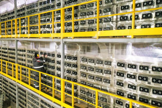 A solo engineer tends to a large cryptocurrency mining operation in Russia.  (Photo: Alexander Ryumin via Getty Images)