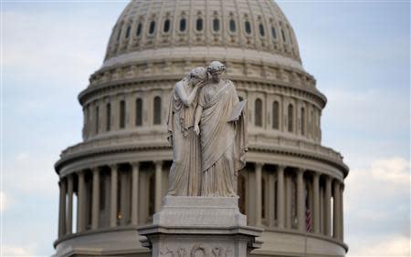 The statue of Grief and History stands in front of the Capitol Dome in Washington October 15, 2013. REUTERS/Joshua Roberts