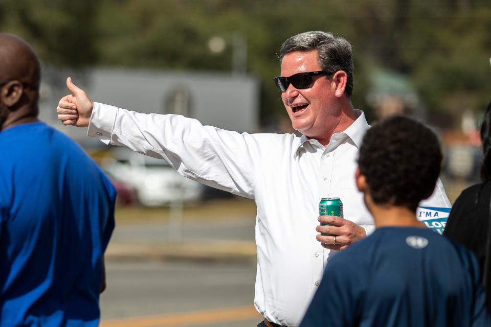 John Dailey greets voters at the Souls to the Polls event on Sunday, Nov. 6, 2022 at the Dr. B. L. Perry, Jr. Branch Library in Tallahassee, Fla. 