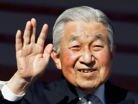 FILE PHOTO : Japan's Emperor Akihito waves to well-wishers during a public appearance for New Year celebrations at the Imperial Palace in Tokyo, Japan, January 2, 2019. REUTERS/Issei Kato/File Photo