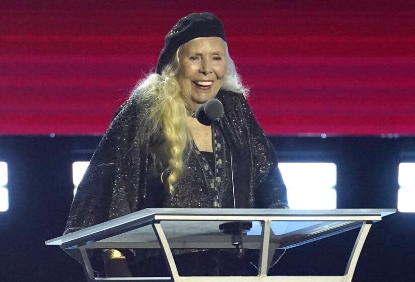 Joni Mitchell accepts the Person of the Year award at the 31st annual MusiCares benefit gala on Friday, April 1, 2022, at the MGM Grand Conference Center in Las Vegas. (AP Photo/Chris Pizzello)