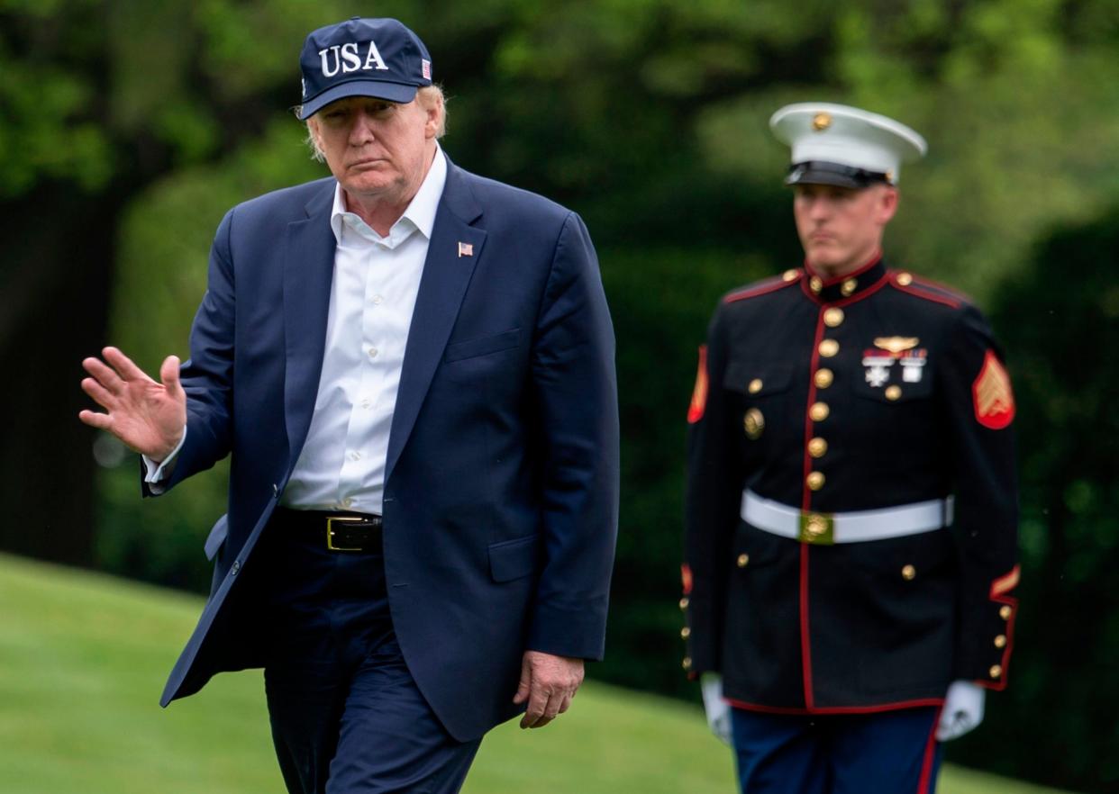 President Donald Trump waves as he walks from Marine One at the White House on 3 May (Photo by ANDREW CABALLERO-REYNOLDS/AFP via Getty Images): AFP via Getty Images