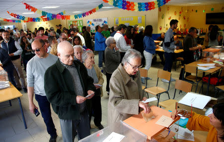 A woman casts her vote during Spain's general election in Madrid, Spain, April 28, 2019. REUTERS/Javier Barbancho