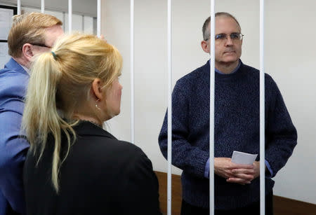 Former U.S. Marine Paul Whelan, who was detained on suspicion of spying, stands inside a defendants' cage as he attends a court hearing regarding the extension of his detention, in Moscow, Russia, May 24, 2019. REUTERS/Shamil Zhumatov