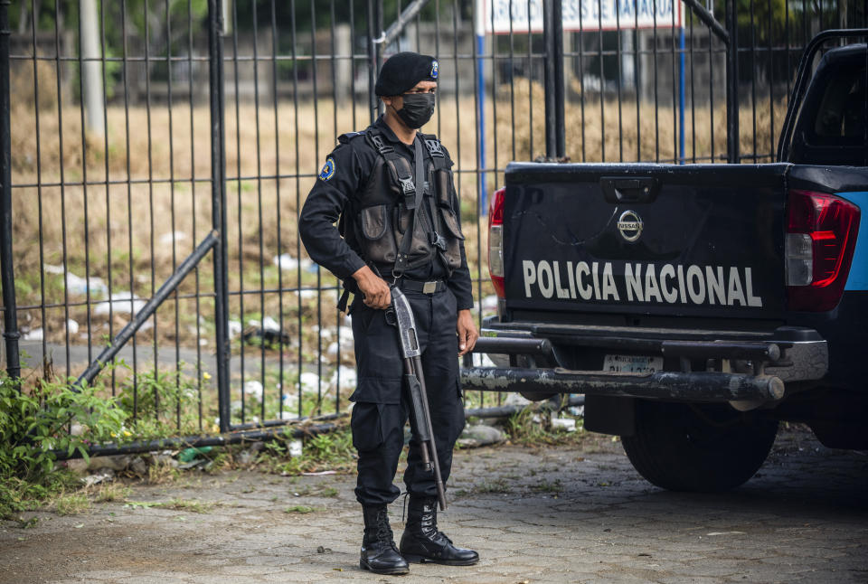 A policeman stands guard outside the Cathedral in Managua, Nicaragua, Saturday, Aug. 13, 2022. The Catholic Church called on faithful to peacefully arrive at the Cathedral in Managua Saturday after National Police denied permission for a planned religious procession on “internal security” grounds. (AP Photo)