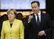 Britain's Prime Minister David Cameron (R) accompanies German Chancellor Angela Merkel as they visit the British Museum in London January 7, 2015. REUTERS/Facundo Arrizabalaga/pool