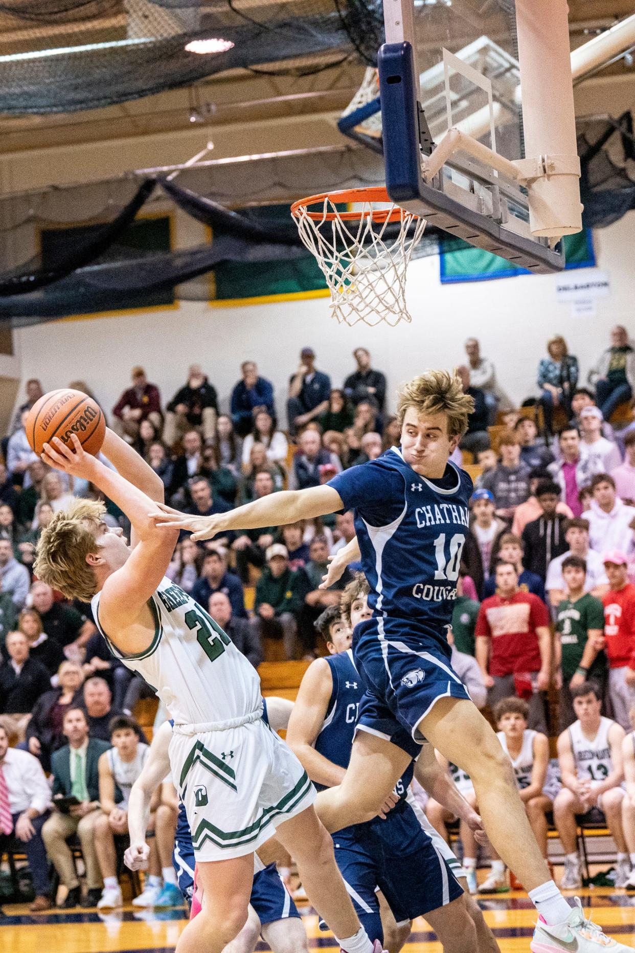 Chatham plays Delbarton in the Morris County Tournament boys basketball semifinals at County College of Morris in Randolph, NJ on Saturday, Feb. 11, 2023. D #24 John Riley and C #10 Mike Tedesco. 