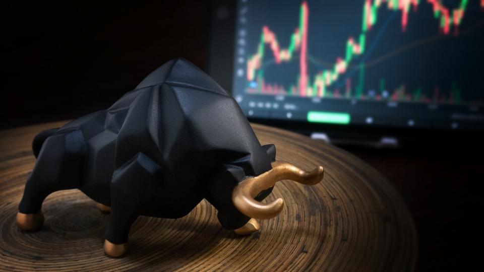 A bull figurine for a trading screen.