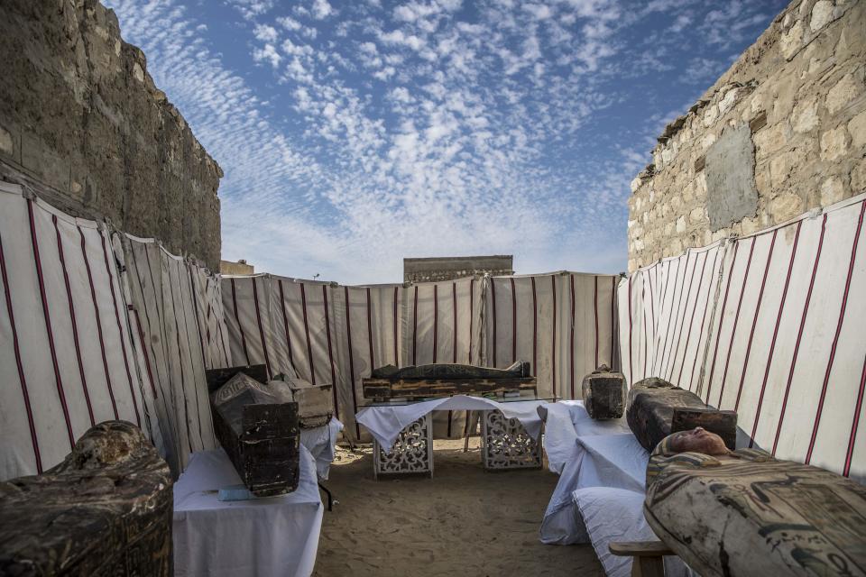 Unearthed adorned wooden sarcophagi are displayed during the official announcement of the discovery by an Egyptian archaeological mission of a new trove of treasures at Egypt's Saqqara necropolis south of Cairo, on January 17, 2021.  / Credit: KHALED DESOUKI/AFP via Getty Images