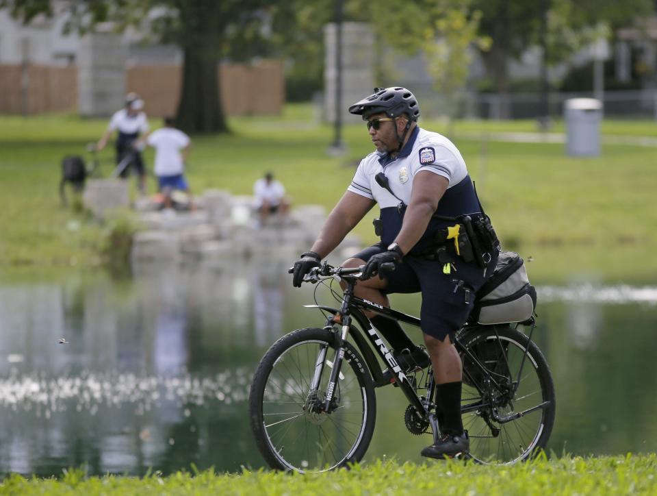 Columbus police Officer James Ridley patrols the park at Linden Community Center by bicycle in August. Police Chief Elaine Bryant had authorized putting bike officers in select parks around the city last year.