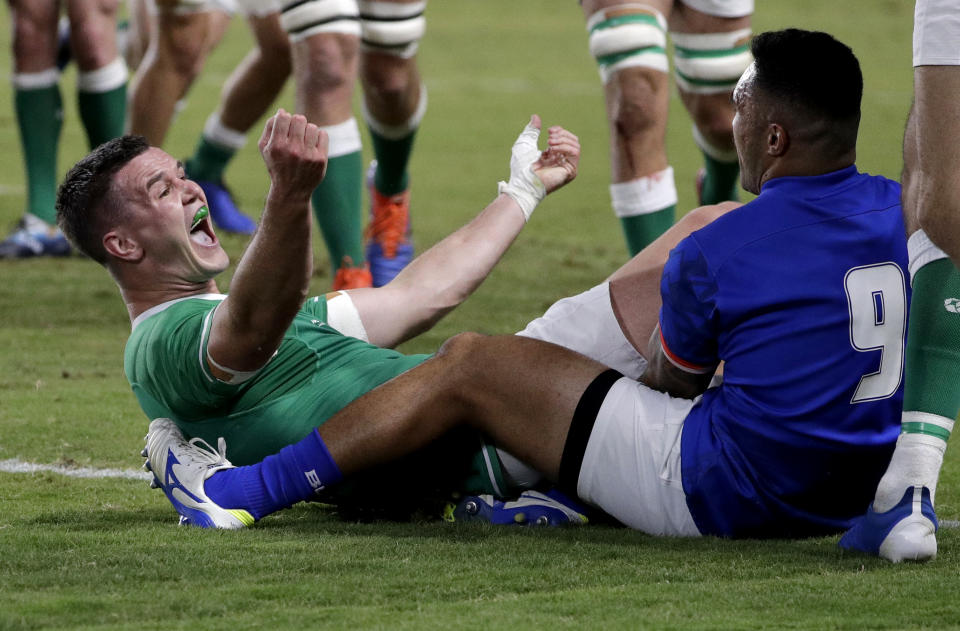 Ireland's Johnny Sexton celebrates after scoring a try during the Rugby World Cup Pool A game at Fukuoka Hakatanomori Stadium between Ireland and Samoa, in Fukuoka, Japan, Saturday, Oct. 12, 2019. (AP Photo/Aaron Favila)