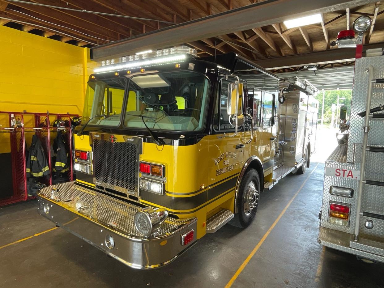 One of Fort Meade's two newly delivered fire trucks is seen inside the city's fire station. The trucks are too tall to fit easily in the station and are being temporarily stored at a warehouse.