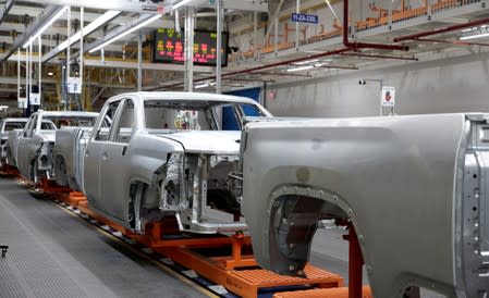 FILE PHOTO: The frames of Chevrolet 2019 heavy-duty pickup trucks sit on the assembly line in the paint department at General Motors Flint Assembly Plant