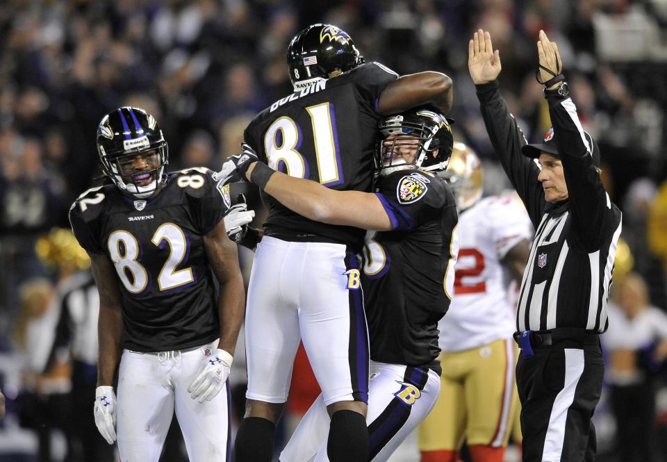 Baltimore Ravens tight end Dennis Pitta, right, celebrates his touchdown with teammates Anquan Boldin (81) and Torrey Smith (82) against the San Francisco 49ers in Baltimore, Thursday, Nov. 24, 2011. | Gail Burton, Associated Press