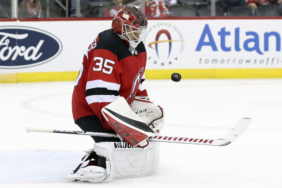 New Jersey Devils goaltender Cory Schneider makes the save against the New York Islanders during the third period of a preseason NHL hockey game, Saturday, Sept. 21, 2019, in Newark, N.J. The Devils won 4-3. (AP Photo/Mary Altaffer)