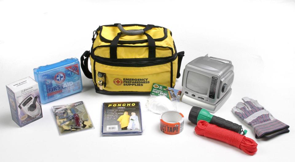 A Hurricane Emergency Kit, with a battery-powered TV and AM/FM radio, two flashlights, a multi-function knife, emergency whistle, compass, rope clamp, work gloves, first-aid kit, rope, duct tape, air masks and batteries.