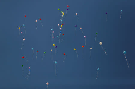 FILE PHOTO: Balloons are released by journalists and press freedom activists during a demonstration in solidarity with the members of the opposition newspaper Cumhuriyet who were accused of supporting a terrorist group outside a courthouse, in Istanbul, Turkey, July 24, 2017. REUTERS/Murad Sezer/File Photo