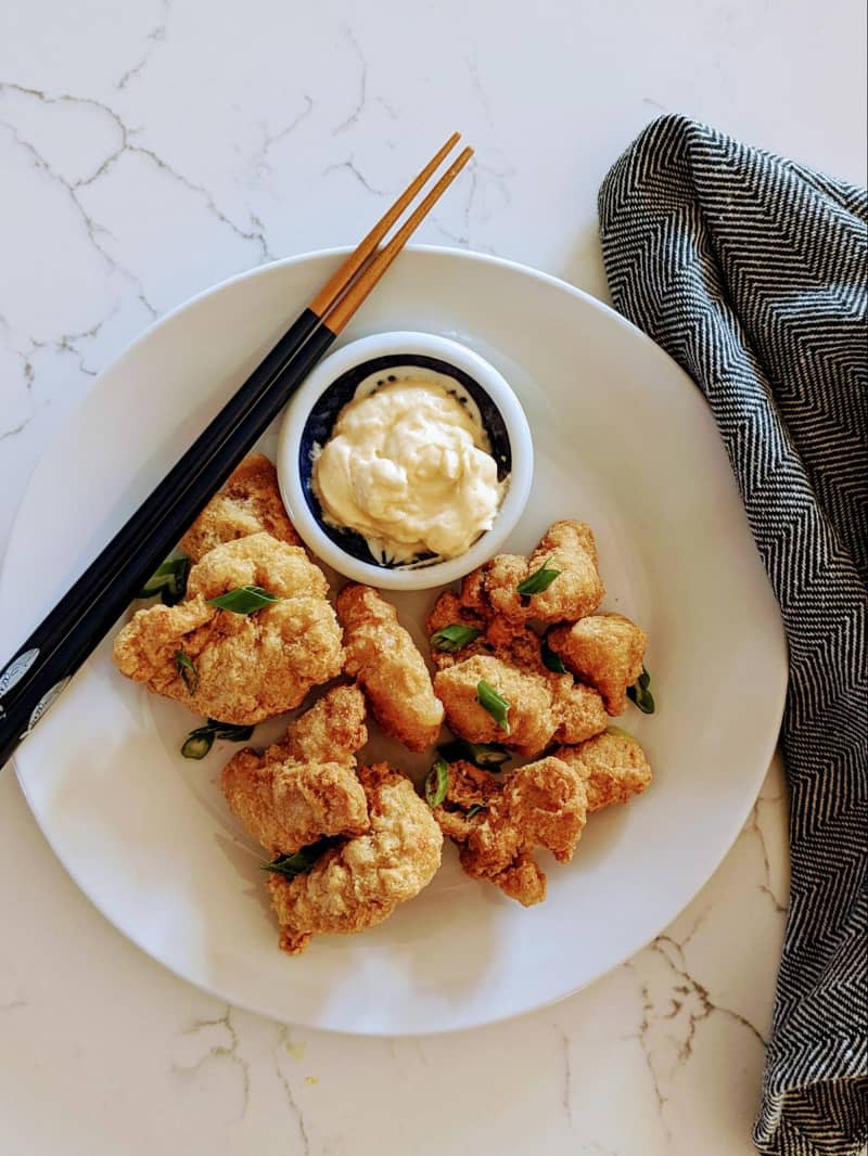 Plated Trader Joe's chicken karaage with sauce on the side.