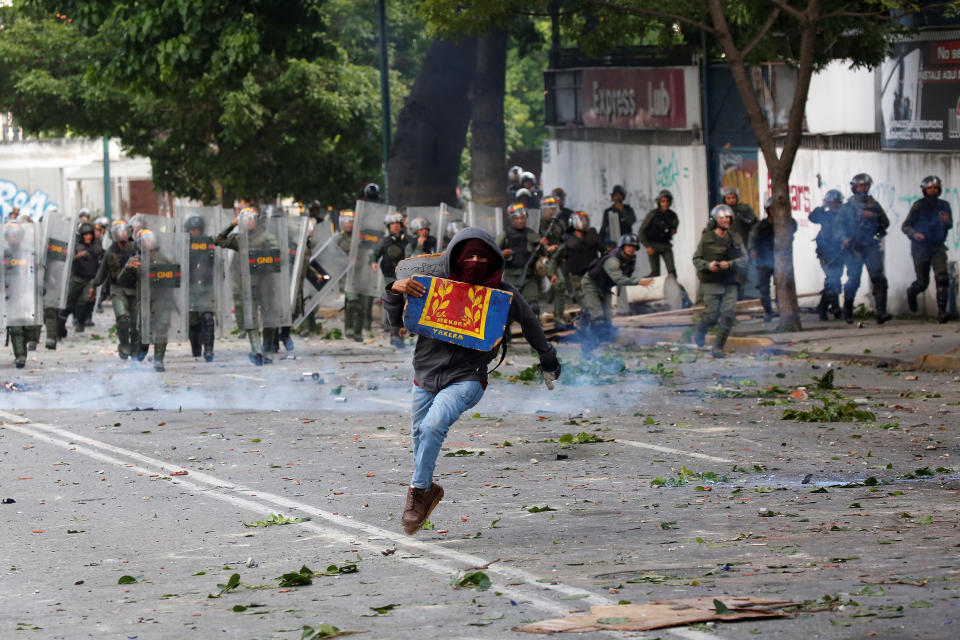 A demonstrator runs away from security forces on July 26.