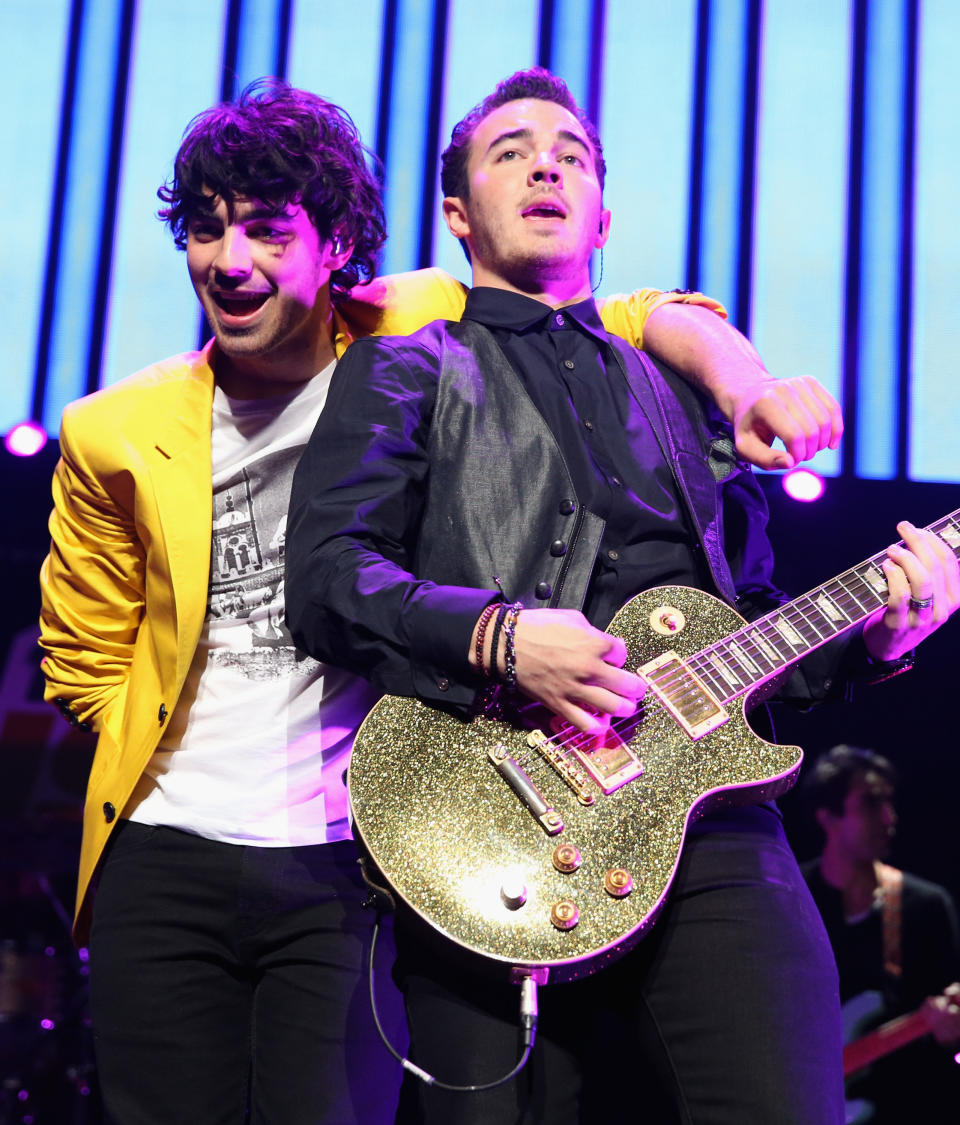 LOS ANGELES, CA - DECEMBER 01:  Musicians Joe Jonas (L) and Kevin Jonas of the Jonas Brothers performs onstage during KIIS FM's 2012 Jingle Ball at Nokia Theatre L.A. Live on December 1, 2012 in Los Angeles, California.  (Photo by Christopher Polk/Getty Images for Clear Channel)