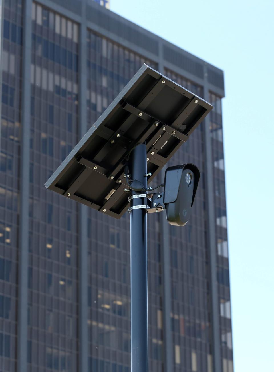 A Flock automatic license plate reader camera, owned by Penn Square Mall, stands near the south mall entrance.