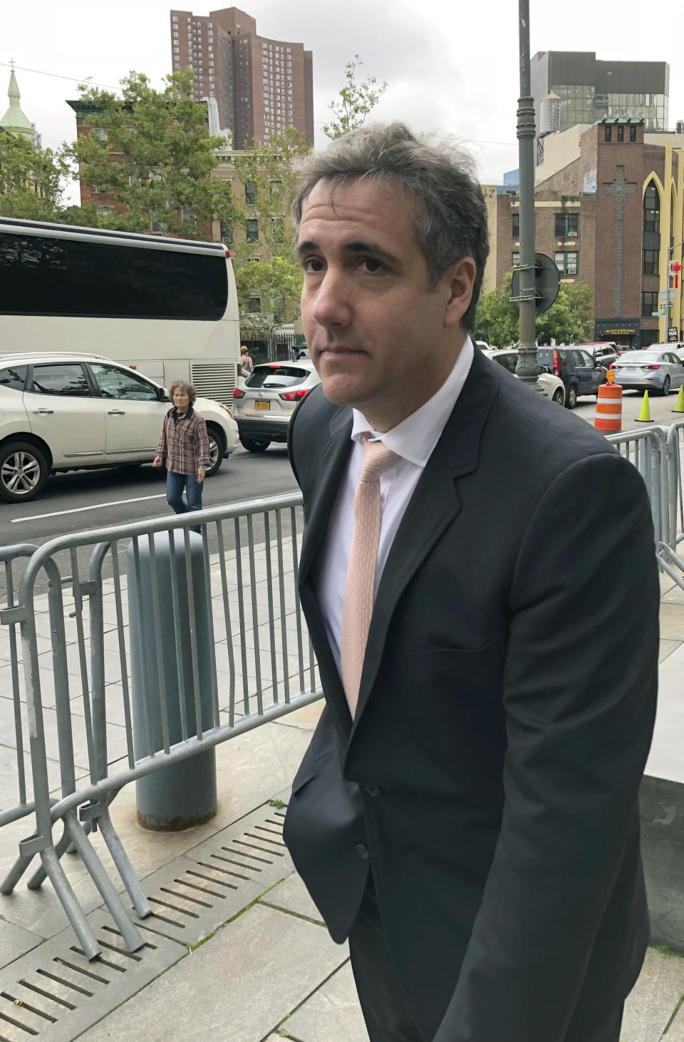 Michael Cohen, President Trump's former lawyer, waits for his ride after making an unannounced visit to the federal courthouse in New York, Friday, Sept. 21, 2018. Cohen left the building, declining to say why he was there as well as refusing to talk about any discussions he's had with special counsel Robert Mueller. (AP Photo/Larry Neumeister)