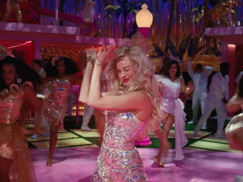 Margot Robbie as Barbie in dance scene for 'Barbie' movie.