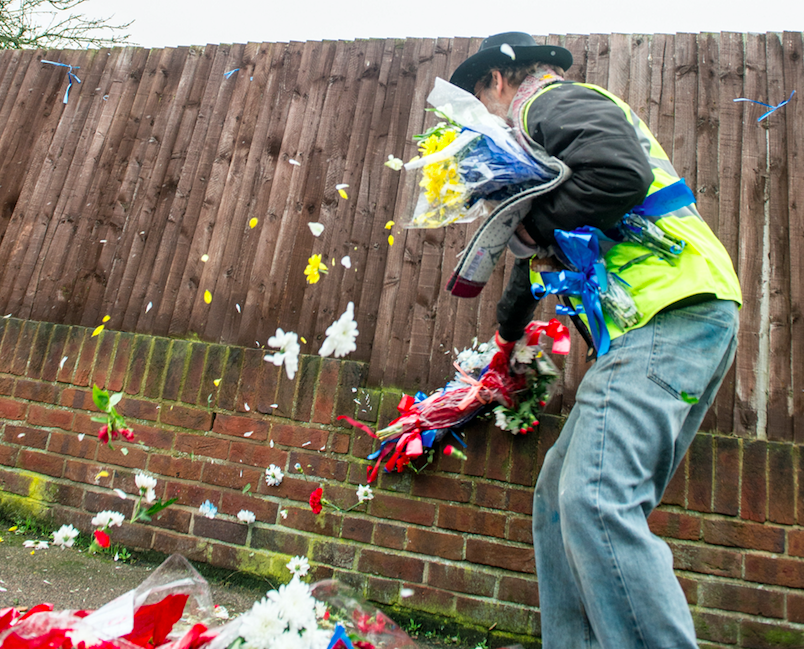 The man pulling them down blasted the people leaving tributes (SWNS)