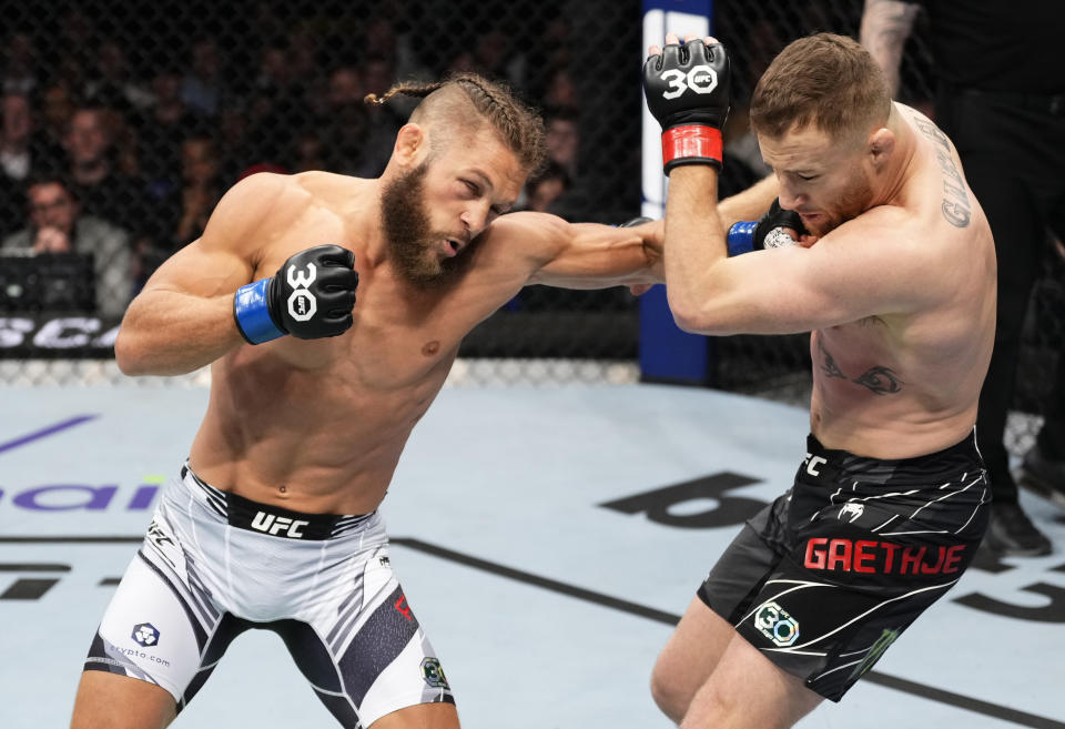 LONDON, ENGLAND - MARCH 18: (L-R) Rafael Fiziev of Kazakstan punches Justin Gaethje in a lightweight fight during the UFC 286 event at The O2 Arena on March 18, 2023 in London, England. (Photo by Jeff Bottari/Zuffa LLC via Getty Images)