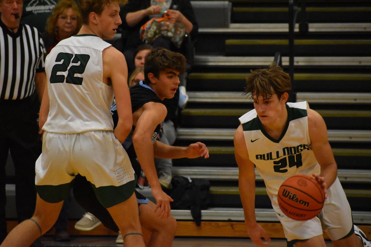 Monrovia senior Gaven Followell drives into the lane following a screen by Austin Leeds in their game against Cascade on Dec. 3, 2021.