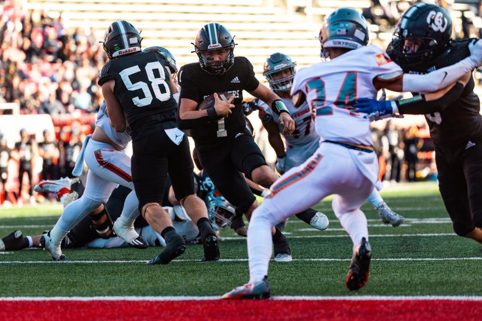 Corner Canyon High School’s Isaac Wilson carries the ball into the end zone for a touchdown during the 6A football state championship against Skyridge High School at Rice-Eccles Stadium in Salt Lake City on Friday, Nov. 17, 2023. | Megan Nielsen, Deseret News