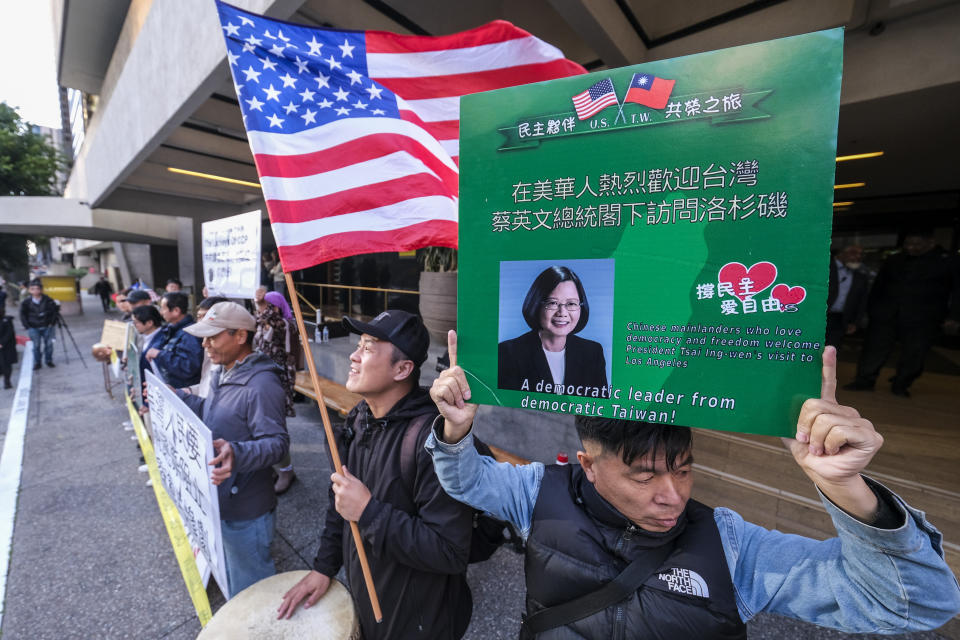 Supporters of Taiwan gather outside a hotel where Taiwanese President Tsai Ing-wen is expected to arrive in Los Angeles Tuesday, April 4, 2023. (AP Photo/Ringo H.W. Chiu)