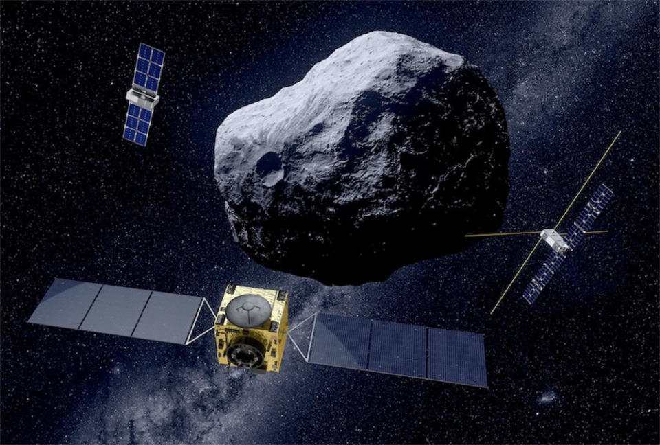 An artist's impression of the European Space Agency's Hera probe and two smaller subsatellites that will work together to explore the asteroid Didymos and its small moon Dimorphos. The moon was hit by NASA's DART probe in 2022, demonstrating the feasibility of deflecting a threatening asteroid if necessary. Hera will provide more data on how exactly the moon's orbit was affected, along with collecting data on its composition and structure. / Credit: ESA