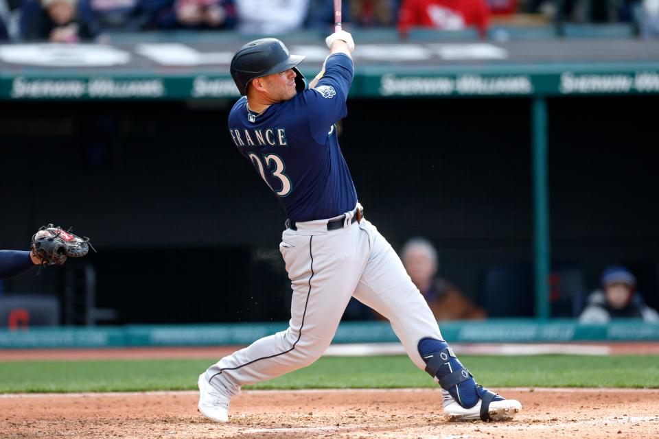 Ty France hits an RBI single for the Mariners off Guardians starter Aaron Civale during the fifth inning, Friday, April 7, 2023, in Cleveland.