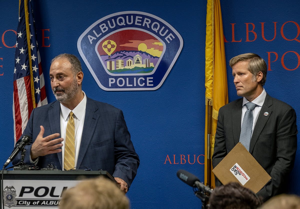 Ahmad Assed, president of the Islamic Center of New Mexico, left, speaks at a news conference to announce the arrest of the alleged perpetrator  (ASSOCIATED PRESS)