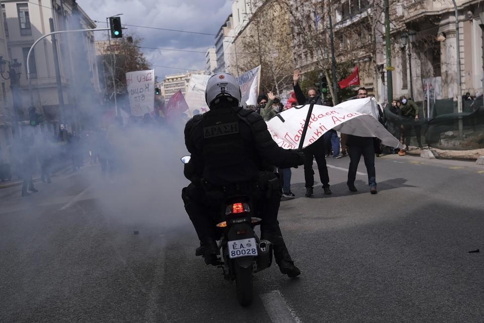 Riot police operate against demonstrators during clashes in Athens, Greece, Sunday, March 5, 2023. Thousands protesters, take part in rallies around the country for fifth day, protesting the conditions that led the deaths of dozens of people late Tuesday, in Greece's worst recorded rail accident. (AP Photo/Aggelos Barai)