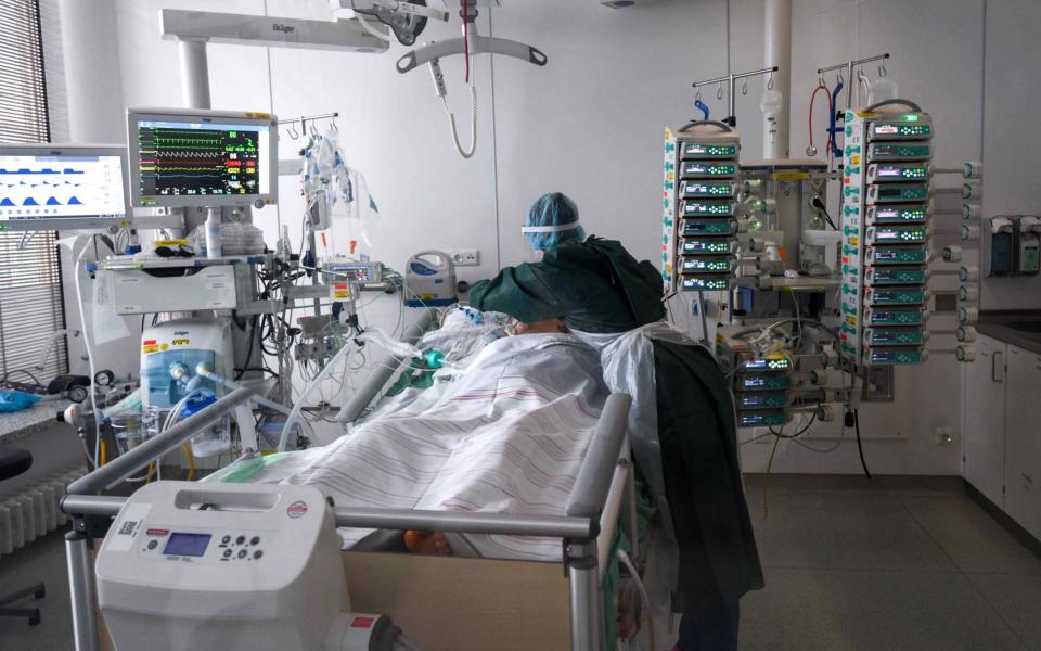 A nurse takes care of a Covid-19 patient in the Covid-19 intensive care unit of the university hospital in Essen, western Germany,  - AFP