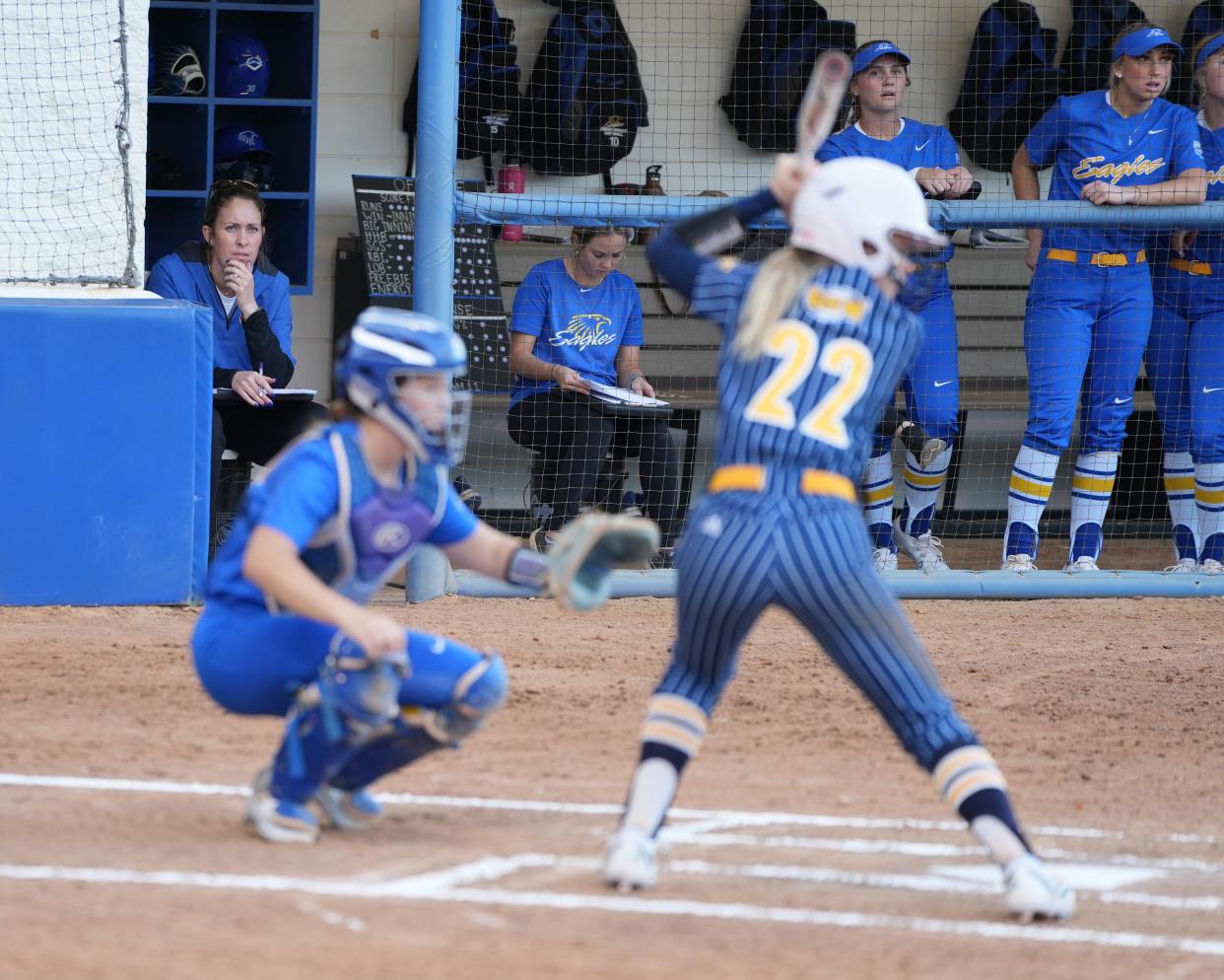 Kelsi Dunne Diaz, shown in the background, topped 200 career wins as Embry-Riddle's softball coach.