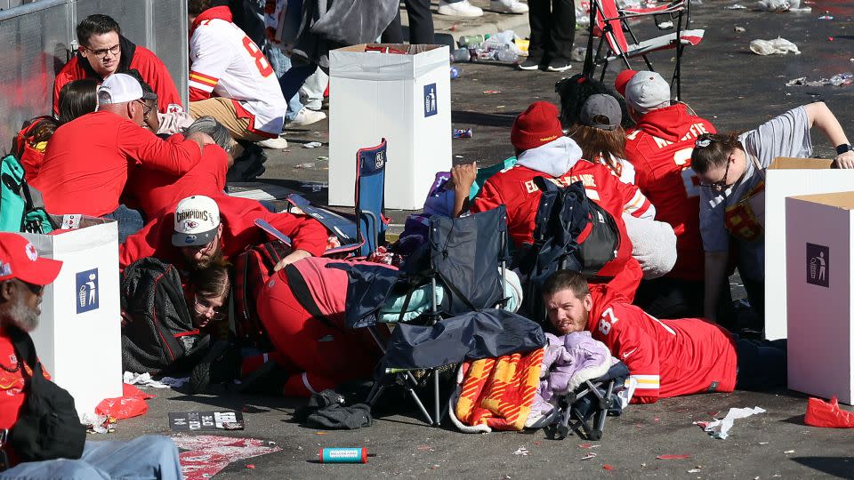 People take cover as shots ring out near Union Station during the Chiefs victory festivities. - Jamie Squire/Getty Images