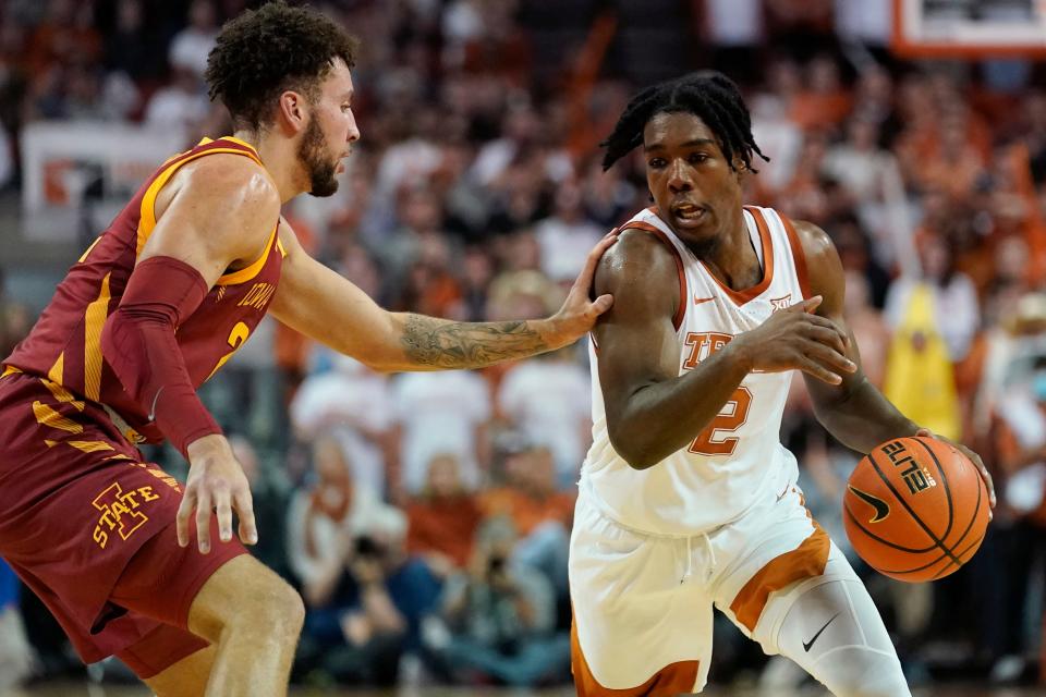 Texas guard Marcus Carr drives around Iowa State guard Gabe Kalscheur during the second half of Saturday's Big 12 Conference game in Austin, Texas.