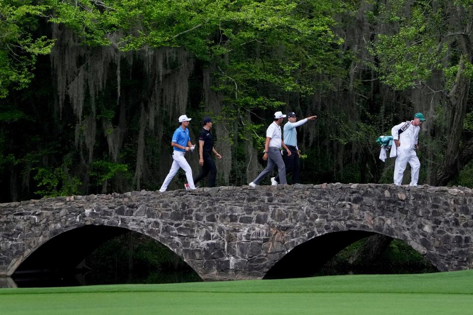 Joaquin Niemann Camilo Villegas, Santiago de la Fuente and Sergio Garcia cross the Nelson Bridge during a practice round for The Masters on April 9, 2024.