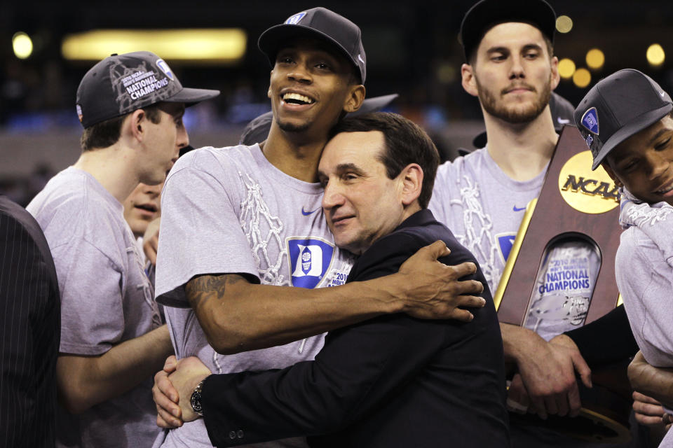 FILE - In this April 5, 2010, file photo, Duke head coach Mike Krzyzewski and guard Lance Thomas embrace after Duke's 61-59 win over Butler in the men's NCAA Final Four college basketball championship game, in Indianapolis. The 2010s had some of the greatest NCAA Tournament games in college basketball history, from Duke's epic win over Butler in 2010 to Villanova's last-second win over North Carolina in 2016. (AP Photo/Michael Conroy, File)